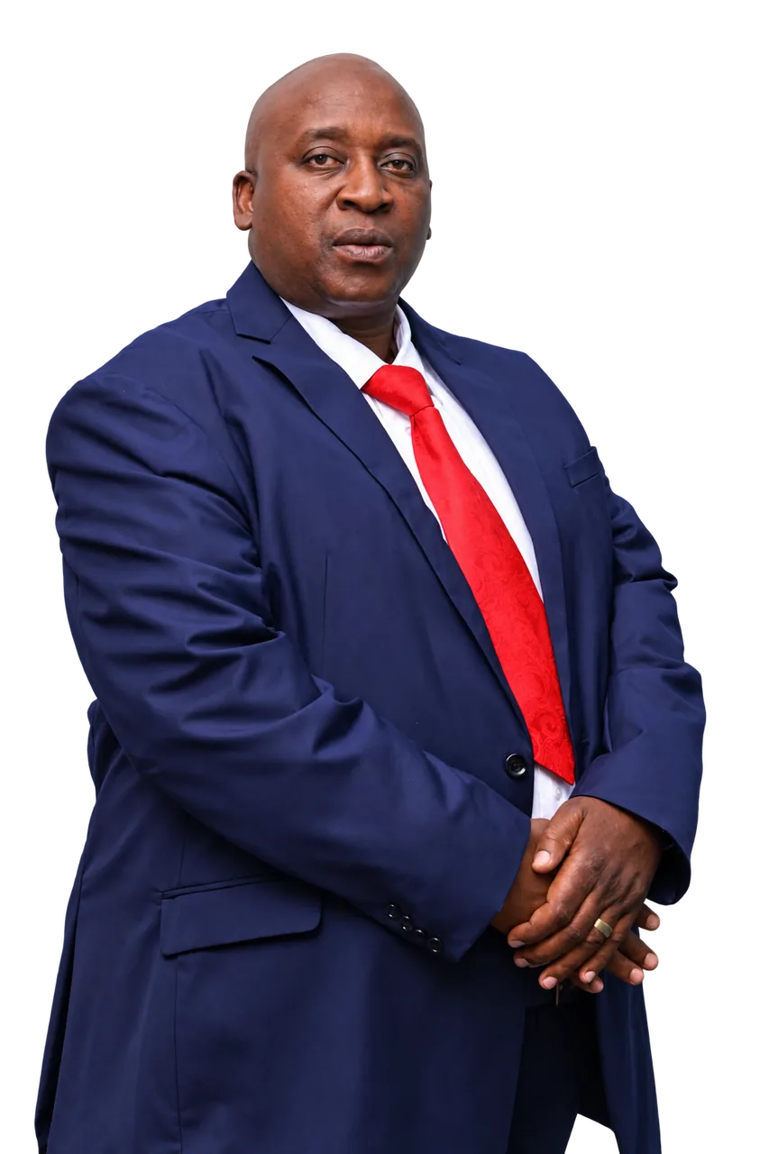 Bishop Professor Mpeli Mwaisumbe akiwa na tai nyekundu